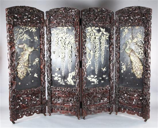 An impressive Japanese carved wood, ivory and Shibayama four-fold screen, by Kobayashi, Meiji period, 203cm x 268cm